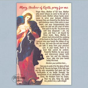 May include: A religious art print featuring an illustration of Mary, Undoer of Knots. The artwork depicts Mary in flowing robes, with a halo, untangling knots. The print includes a prayer and the words "Metanoia Grace".