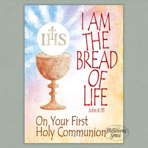 May include: A religious-themed print with a chalice and host illustration. The text reads "I AM THE BREAD OF LIFE" and "On Your First Holy Communion". The background has a watercolor effect with blue, yellow, and orange hues.