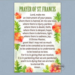 May include: A rectangular print featuring the "Prayer of St. Francis" text in black, surrounded by watercolor-style orange flowers and green foliage. The print has a light green background and includes the "MetanoiaGrace" logo.