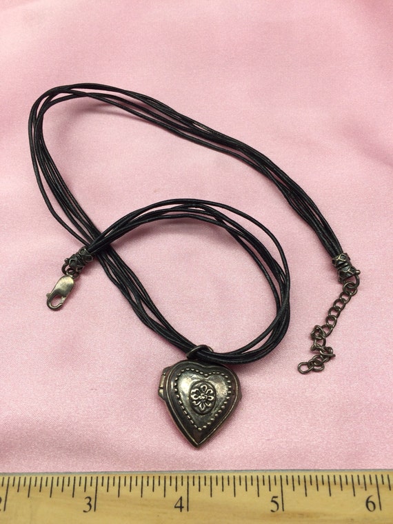 Leather necklace with metal heart locket - image 1