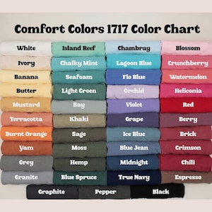 May include: A color chart titled "Comfort Colors 1717 Color Chart" displays a variety of fabric colors. The chart includes shades like white, ivory, banana, butter, mustard, terracotta, burnt orange, yam, grey, and granite.