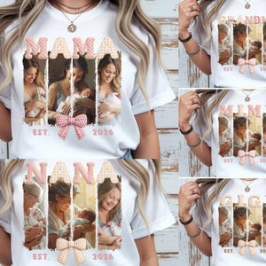 Puede incluir: Camisetas blancas con varios diseños. Una camiseta presenta la palabra "MAMA" con fotos y un lazo rosa. Otras camisetas dicen "GRANDMA", "MIMI", "NANA" y "GIGI", cada una con fotos y un lazo. También se muestra el año "2026".