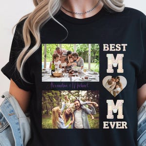 May include: Black t-shirt with family photos and the text "BEST MOM EVER." The shirt features two rectangular photos and one heart-shaped photo. The photos show a family enjoying time together. The names "Alexandra & Michael" are written in cursive.