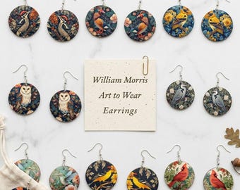 May include: A collection of round, dangling earrings featuring various bird illustrations set against floral backgrounds. A central square note displays the text: William Morris Art to Wear Earrings. Each earring is equipped with a silver-toned hook.