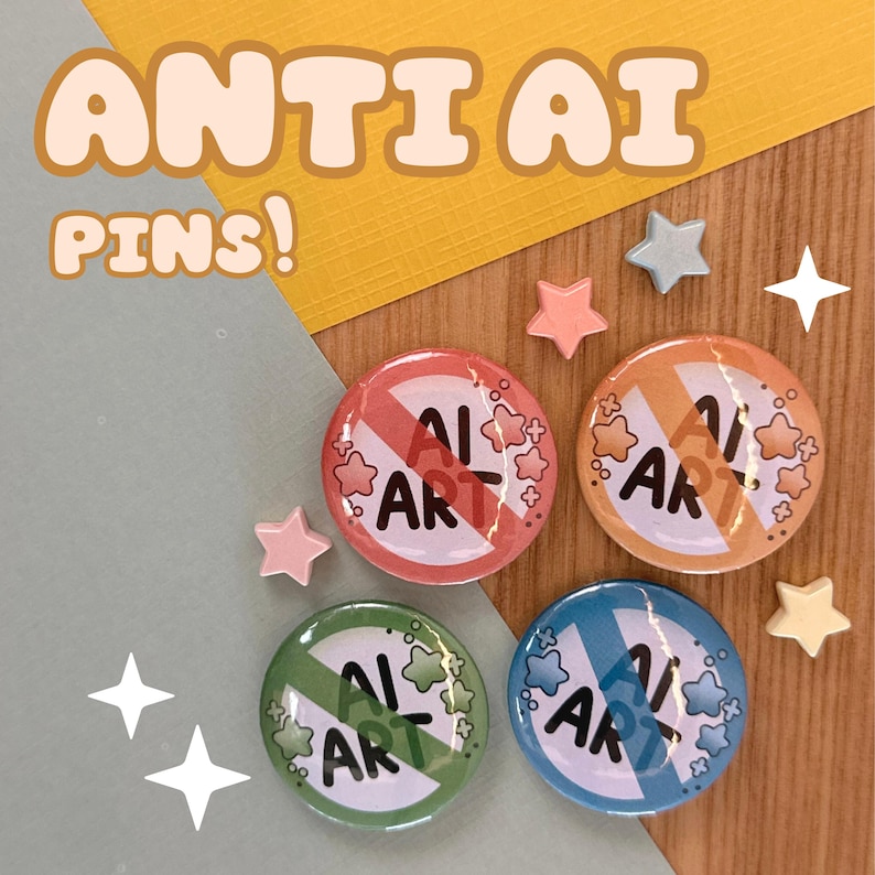 May include: Four round pins with the text "AI ART" crossed out, each in a different color: red, orange, green, and blue. The pins are surrounded by star-shaped embellishments and the words "ANTI AI PINS!" are at the top.