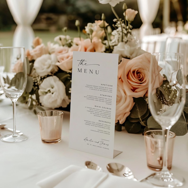 A sleek and elegant wedding menu card displayed on a beautifully set table, featuring roses and candles, showcasing the appetizer, main course, and dessert details. Perfect for adding sophistication to your wedding reception.