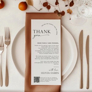 Modern and elegant wedding thank you card placed on a fall-inspired place setting with warm tones and neutral decor. This editable thank you card template includes a heartfelt message and a QR code, making it a unique digital thank you for weddings. A stylish way to gift guests a personalized thank you note they’ll remember. Perfect for use as a printable thank you or place setting card.