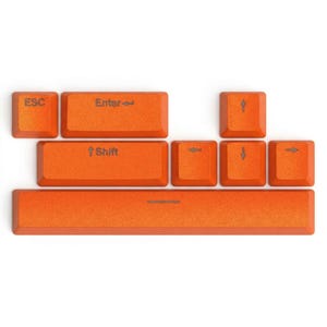 May include: A collection of orange keyboard keys, including ESC, Enter, Shift, arrow keys, and a space bar. The keys have a textured surface and are arranged against a white background. The Enter key has an arrow pointing to the right.