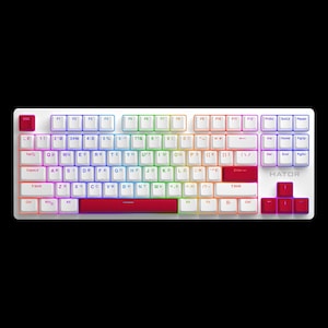 May include: White mechanical keyboard with multi-colored backlit keys. The keyboard has a red space bar and red keys on the right side. The brand name "HATOR" is printed on the keyboard.