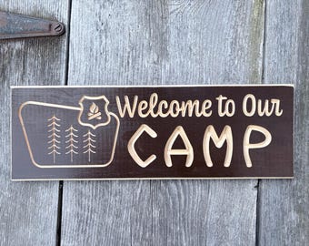 Carved Welcome to Our Camp sign National Forest Sign shape pine trees campfire
