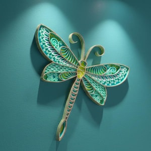 May include: A decorative dragonfly wall art piece in shades of teal, green, and gold. The dragonfly features intricate patterns on its wings and body, mounted on a teal wall. The artwork is illuminated by a spotlight.