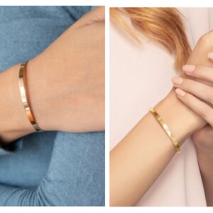 May include: Two images showcasing gold-colored bangles. The first image displays a smooth, polished bangle on a wrist, while the second features a textured, hammered-style bangle. Both are worn on wrists, highlighting the jewelry's design and finish.
