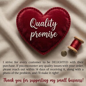 May include: A heart-shaped, red velvet patch with the words "Quality promise" in white script. A spool of red thread and a gold button are next to the heart. The image conveys a message of quality and customer satisfaction.
