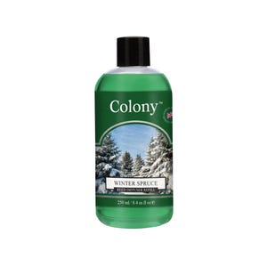 May include: A green Colony Winter Spruce reed diffuser refill bottle with a black cap. The label features a winter forest scene and the text "Winter Spruce" and "250 ml / 8.4 fl oz e".