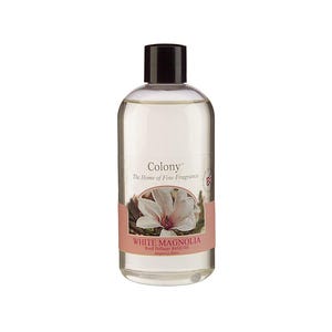 May include: A clear glass bottle of White Magnolia Reed Diffuser Refill Oil from Colony, The Home of Fine Fragrance. The bottle has a black cap and a label with a white magnolia flower.