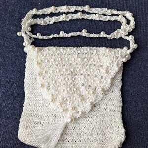 White purse with beads