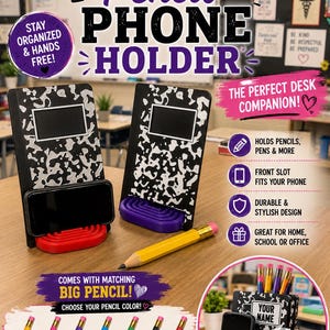 May include: Two black and white composition notebook-style phone holders with a rectangular slot for a phone and a base in red or purple. Each holder includes a large yellow pencil. Text includes COMPOSITION PENCIL PHONE HOLDER and color options.