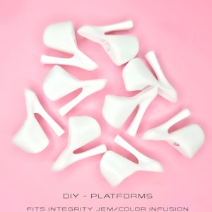 May include: A collection of white, platform-style shoe components arranged on a pink background. The components have a curved design with a supporting leg. The text "DIY - PLATFORMS" is visible.