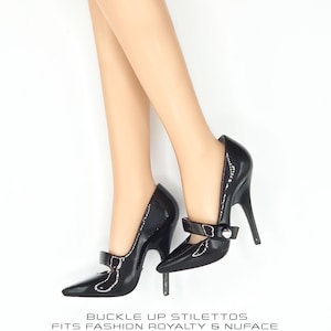 May include: A pair of glossy black high-heeled stilettos with a pointed toe and a single strap featuring a small silver buckle. The text BUCKLE UP STILETTOS FITS FASHION ROYALTY & NUFACE is printed below the shoes on a plain white background.