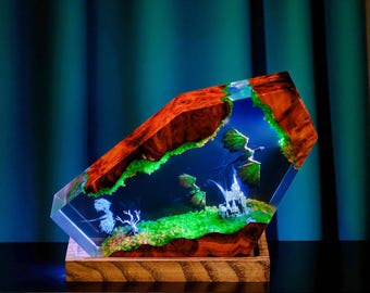 Lámpara de escritorio LED de resina con diseño de dragón fantástico y diorama de castillo.
