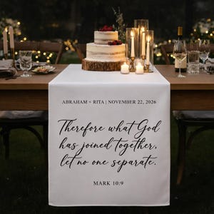 May include: A white table runner with the text "Therefore what God has joined together, let no one separate." and "MARK 10:9". The runner is on a wooden table set for a wedding reception, with a cake and candles.