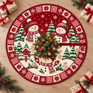 May include: A circular red and white quilted Christmas tree skirt featuring three snowmen, green pine trees, a red birdhouse, and a border pattern of snowflakes and plaid squares. The design includes holly berries and a central evergreen arrangement.
