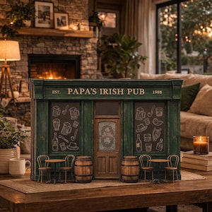 May include: A white ceramic mug with a black handle and the text "But First, Coffee" in a bold, black font. The mug is set against a blurred background, suggesting a cozy setting.