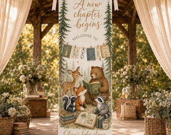 May include: A vertical fabric banner featuring the text A new chapter begins, Welcome to, and Olivia's baby shower October 12, 2026. The design includes illustrations of pine trees, a deer, a bear, a fox, a skunk, a raccoon, and books.