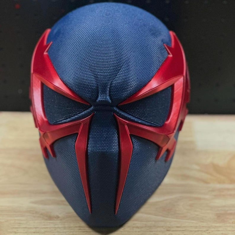 May include: A white ceramic mug with a black handle and the text "But First, Coffee" in a handwritten style. The mug is on a white surface. The mug is approximately 4 inches tall.