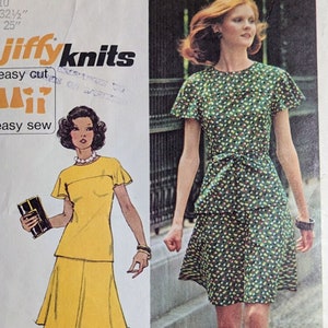 May include: A vintage sewing pattern for a dress with a green and white floral print. The pattern is from Simplicity and is number 6081. The pattern is for stretch knits only and includes instructions for a pick-a-knit rule.