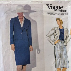 May include: Vogue Patterns American Designer sewing pattern for a skirt and jacket set. The pattern is by John Anthony and the pattern number is 1159.