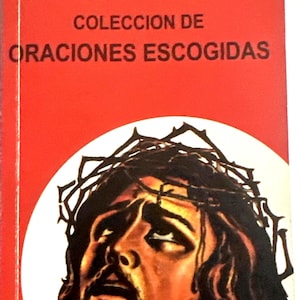 May include: A red book with the title "Nuevo Devocionario Espiritista" and the text "COLECCION DE ORACIONES ESCOGIDAS." The cover shows a portrait of a man with a beard, a crown of thorns, and a white halo.