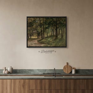 May include: A framed landscape painting depicting a forest scene with a winding dirt path. The artwork features a palette of greens, browns, and yellows, with tall trees and a glimpse of sunlight. The frame is black, and the text "Boiserique Stunning Art" is below the frame.