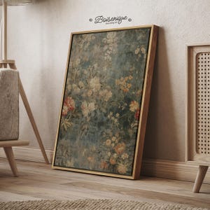 May include: A framed floral print with a wooden frame. The artwork features a vintage-style floral pattern in shades of cream, peach, and green against a teal background. The text "Boisenique Stunning Art" is in the upper left corner.