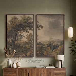 May include: Two rectangular framed wall art prints featuring muted landscape paintings with large trees, rolling hills, and cloudy skies in shades of brown, green, and beige. The artwork is displayed side by side with the text Boisenique Stunning Art.