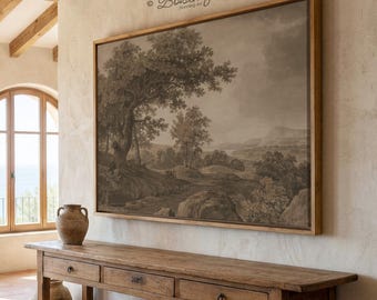 May include: A large framed landscape print in sepia tones hangs on a beige wall. The artwork depicts trees, rocks, and a distant mountain range. A wooden console table with drawers sits below the artwork. The text "Boisenique" is in the upper right corner.