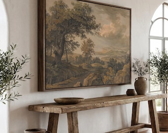 May include: A large rectangular landscape painting in a dark wood frame featuring a muted color palette of greens, browns, and soft sky tones. The artwork depicts a rolling countryside with mature trees, rocky terrain, and a distant horizon line.