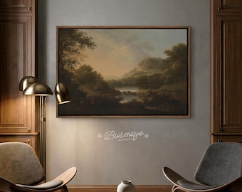 May include: A framed landscape painting depicting a serene lake scene with trees and mountains. The artwork is in a wooden frame and hangs on a gray wall. The room also features a floor lamp, chairs, and a coffee table.