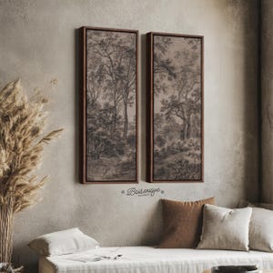 May include: Two tall, rectangular wall art pieces featuring a dark brown wooden frame and a monochromatic landscape illustration of trees and foliage. The artwork displays a detailed forest scene in shades of brown and gray, with the text Boisenique.