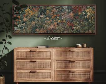 May include: A framed floral print with a variety of colorful flowers hangs above a wooden dresser with woven drawer fronts. The print features a dark background with flowers in shades of yellow, orange, red, and white. The dresser has six drawers.