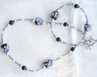 Black and white Glass Lampworked Bead with Silver Accents