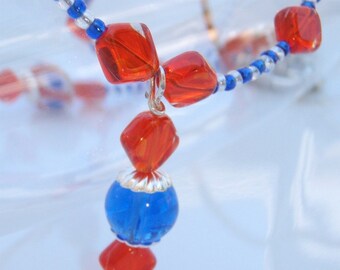 Gator Fun - Cobalt Blue Round Beads, Orange and Blue Lampwork and Hyacinth Red Square beads Necklace