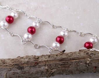 A bracelet with Red and White glass pearls. Pearl bracelet.