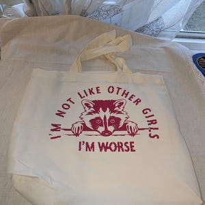Funny tote bag with raccoon design, quirky &quot;I&#39;m Not Like Other Girls&quot; slogan, casual everyday use, perfect gift for animal lover