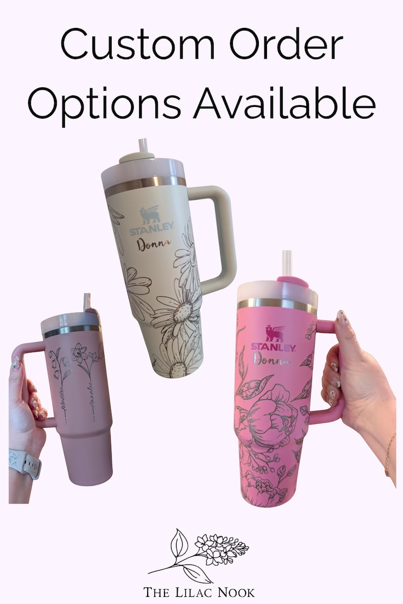 May include: Three Stanley tumblers with handles and straws, featuring custom floral line art engravings and the name Donna. The tumblers are cream, dusty rose, and bright pink. Text at the top reads Custom Order Options Available and The Lilac Nook.
