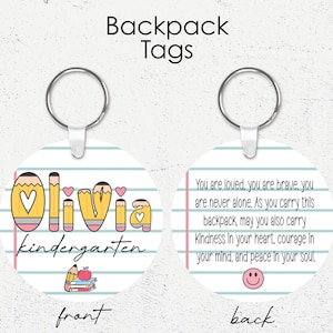 May include: Round backpack tag with the name "Olivia" in a pencil-themed design, with the word "kindergarten" below. The back of the tag has an inspirational message and a smiley face. The tag is attached to a silver keyring.