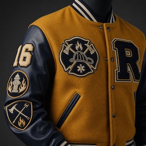 May include: A mustard yellow and navy blue varsity jacket featuring a large embroidered firefighter emblem on the chest, the number 16, a fire hydrant, and crossed axes on the sleeve, with a large letter R on the front and snap button closures.