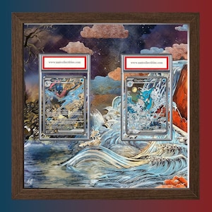 May include: Framed artwork featuring two collectible trading cards. The cards are encased in protective cases and displayed against a detailed, artistic background depicting water and a night sky. The frame is a dark brown color, and the website www.mntcollectibles.com is visible.