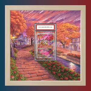 May include: Framed artwork featuring a graded trading card with a colorful fantasy landscape. The artwork is set against a backdrop of a sunset sky and a brick pathway lined with red flowers. The frame is light-colored.
