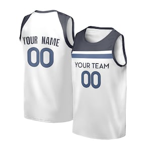 May include: Two white basketball jerseys with navy blue accents. One jersey has "YOUR NAME" and the number "00" on the back. The other jersey has "YOUR TEAM" and the number "00" on the front.